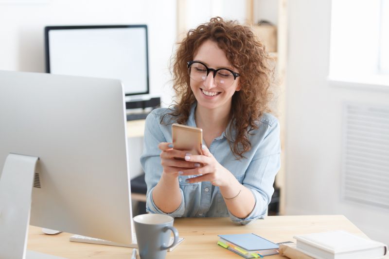 Small business owner smiling in her home office